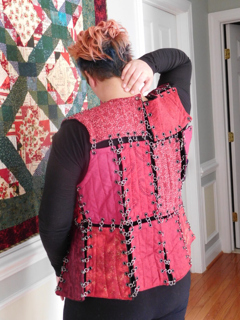 Moonwhispers™ makes reversible QuiltArmor® vests and jackets, featured here is the red side with a black reverse