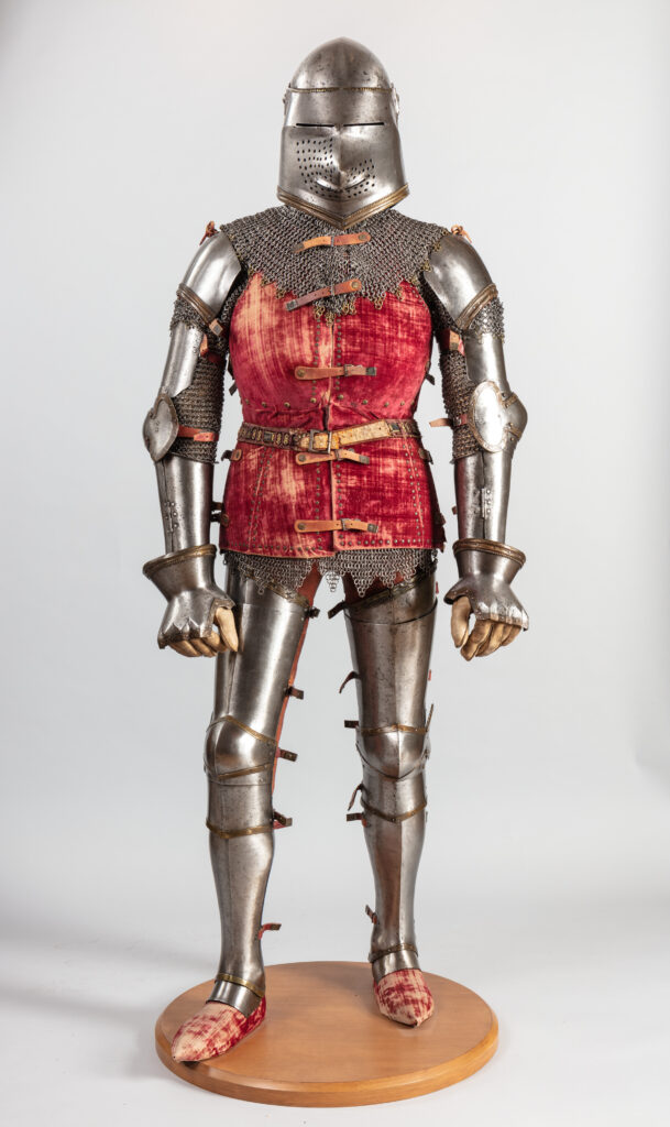 Medieval quilted armor gambeson with suit of metal armor